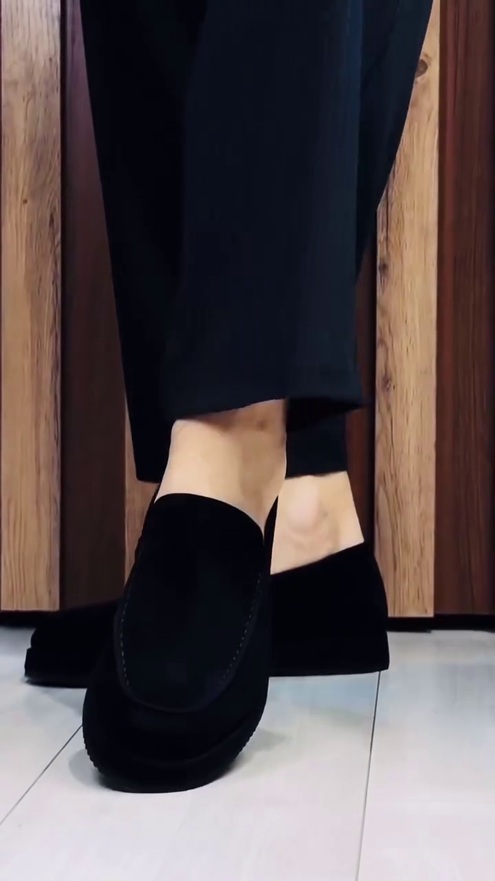 Unisex Minimalist Black Slip-On Platform Loafers with Rounded Almond Toe, Smooth Monochrome Finish, Raised Chunky Sole, Low-Profile Slip-On Construction and Modern Casual Formal Styling