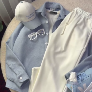 Men’s Sophisticated Light Blue Relaxed Button-Down Shirt Paired with Ivory White Drawstring Trousers, Minimal Collar Design, Long Sleeves and Clean Contemporary Casual Co-Ord Styling